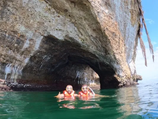 Snorkelers discovering the colorful underwater world of Puerto Vallarta, an unforgettable tour or ocean lovers.