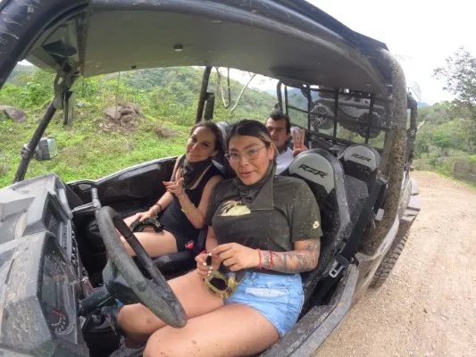 A family enjoying an exciting RZR ride, one of the best experiences offered by adventure tourism companies in Puerto Vallarta.