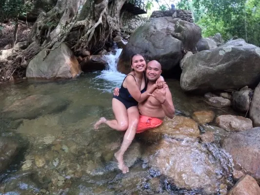  A couple relaxing in the serene hot springs, a perfect experience provided by adventure tourism companies in Puerto Vallarta.