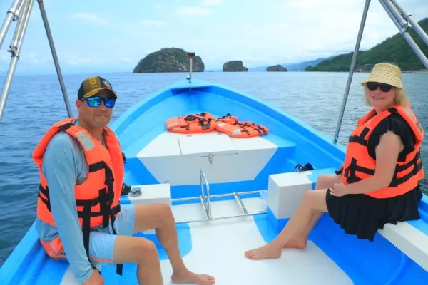 Groups of people enjoying a boat ride, exploring the beauty of Puerto Vallarta’s coastline, one of the top activities.