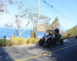A ride in an all-terrain vehicle on roads next to the sea, an exciting way to enjoy outdoor experiences.