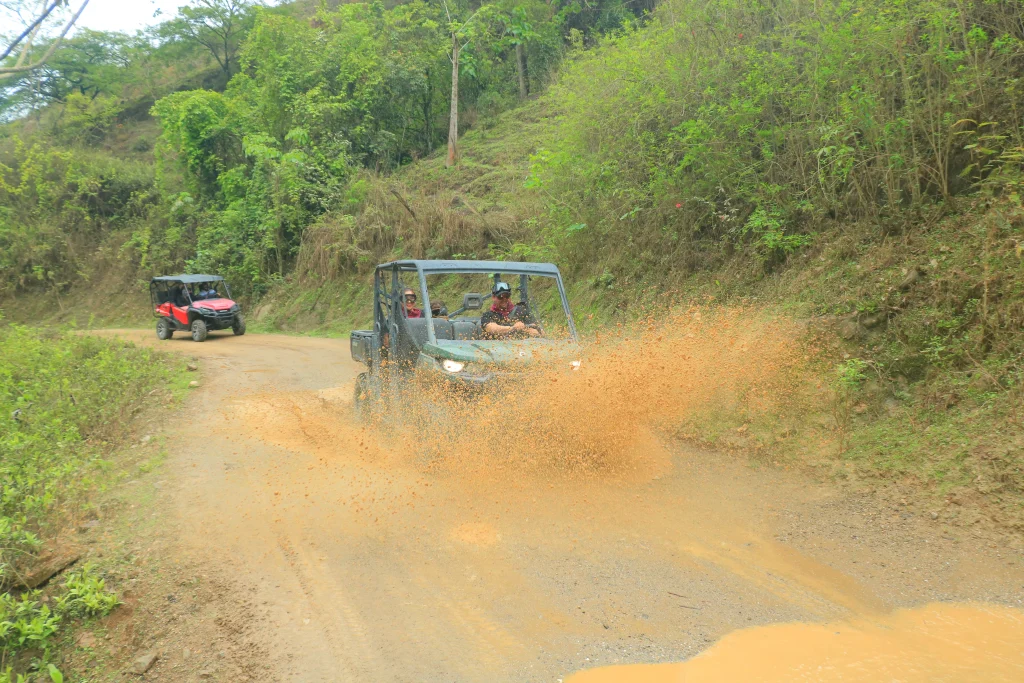 An off-road vehicle speeds down a dirt trail, sparking the common question: do you need a passport to go to Puerto Vallarta.